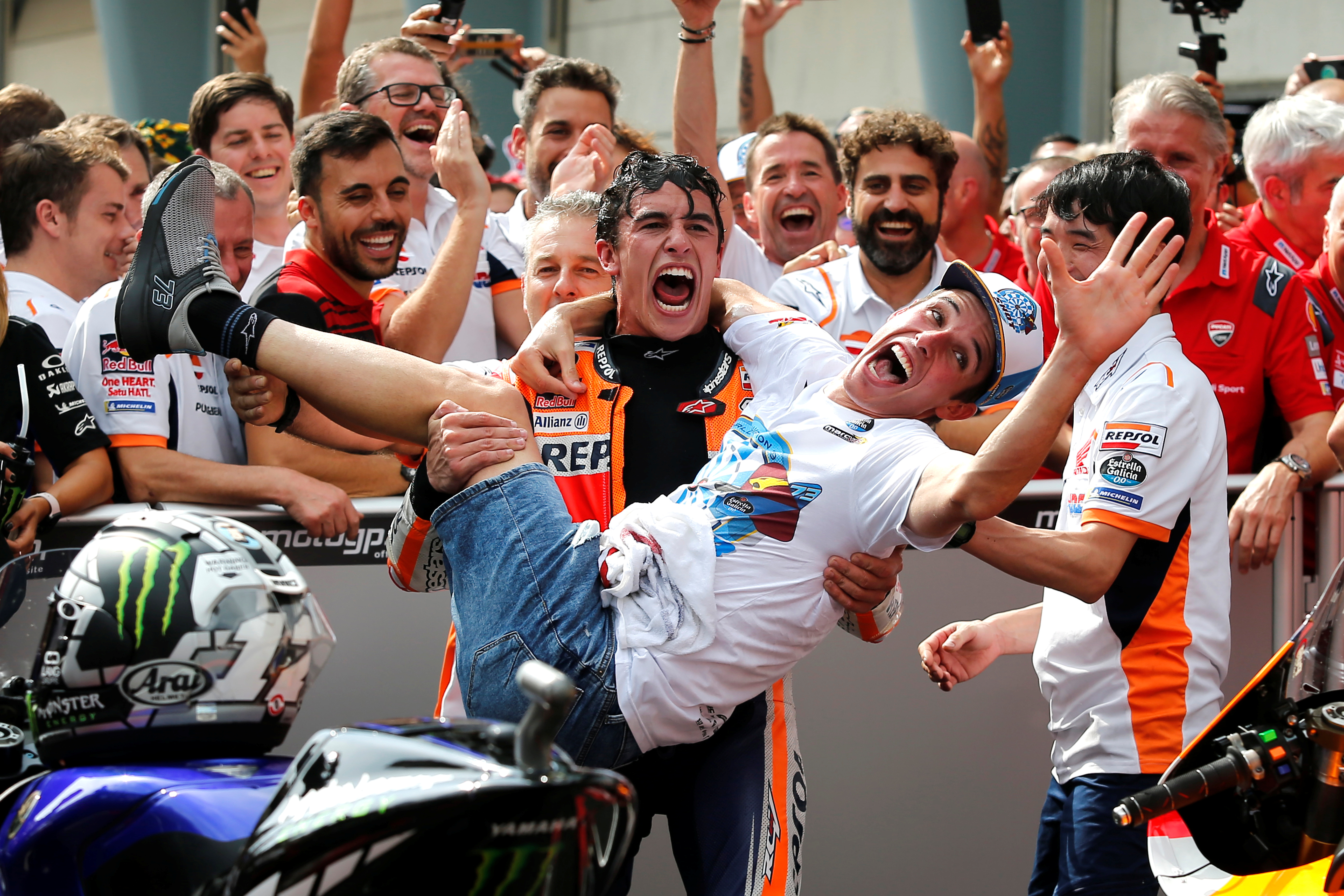 Marc and Àlex Márquez celebrate Moto2 win in Malaysia (by Lai Seng Sin/Reuters)